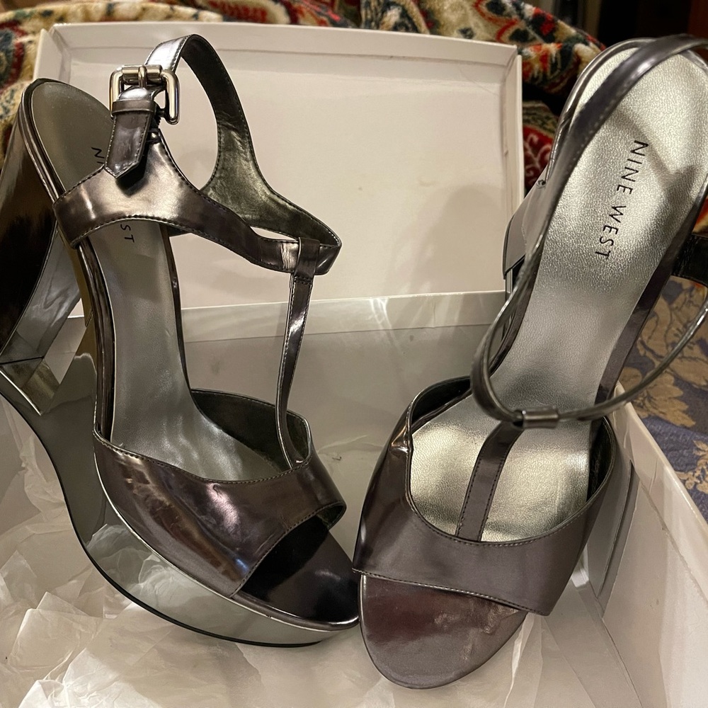 Nine West heels in peuter silver. New in box, never worn.